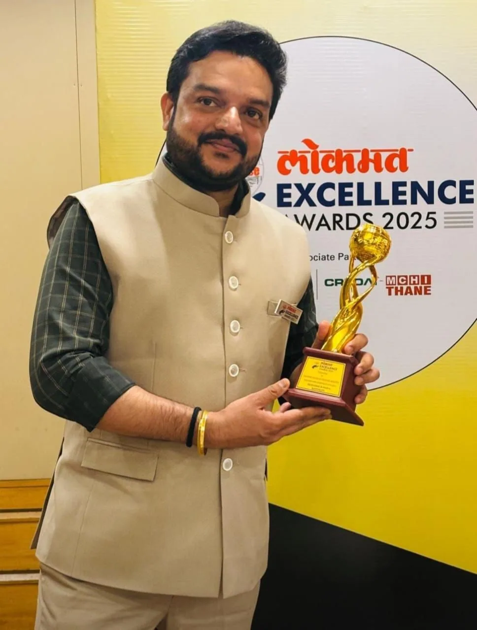 Lokmat Excellence Awards 2025 trophy held by Adarsh Shetty
