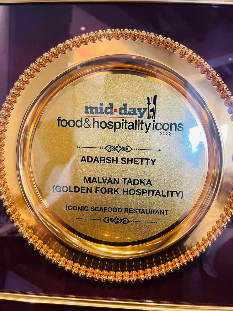 mid-day Food & Hospitality Icons plate awarded to Adarsh Shetty for Malvan Tadka