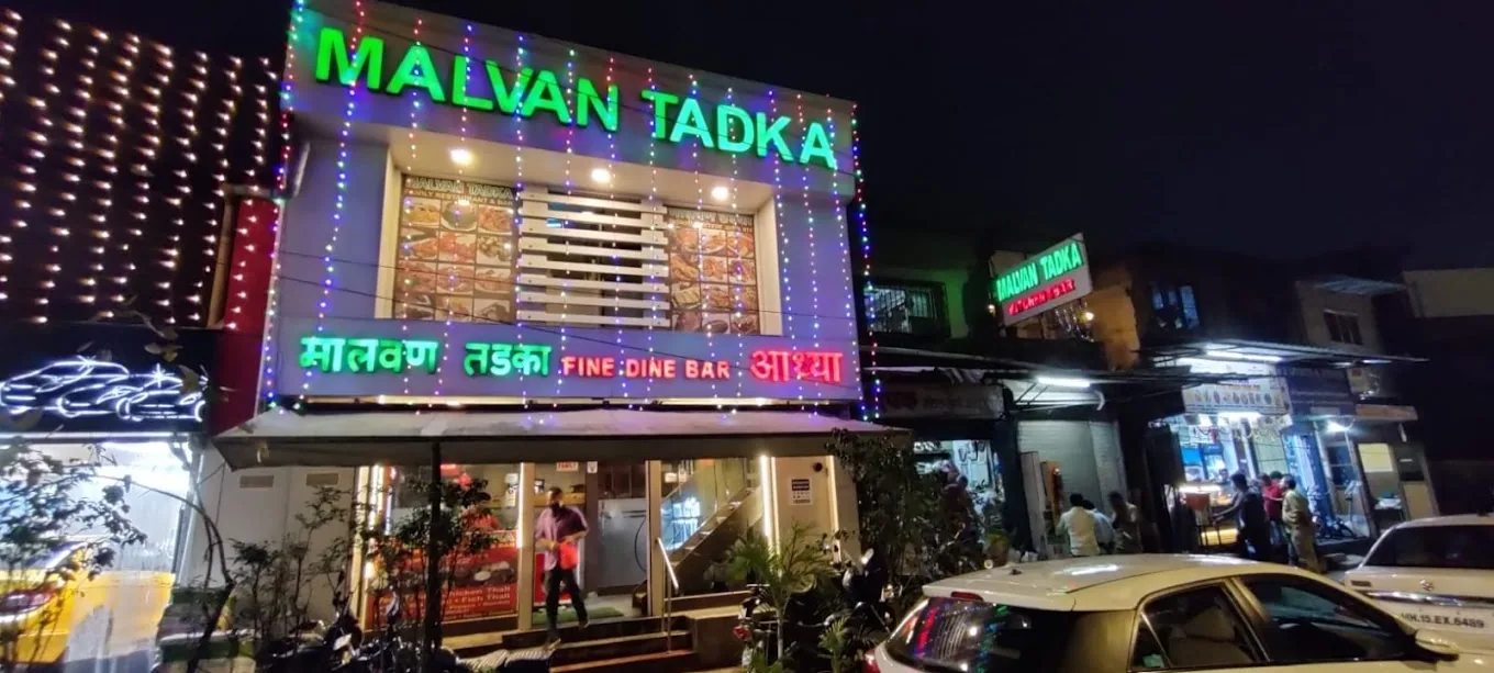 Neon signage strung with fairy lights